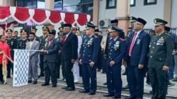 Personel Kodim 1710/Mimika Ikut Taptu dan Pawai Obor Peringatan HUT Ke-80 Kemerdekaan RI
