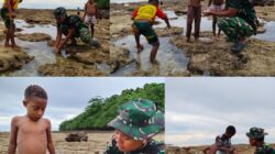 Personel Satgas TMMD Bermain dan Mencari Ikan Bersama Anak-anak Saat Air Laut Surut